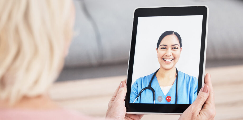 female patient video chats with nurse on ipad